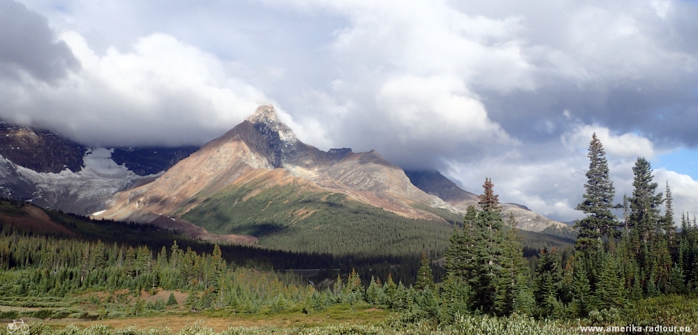 Cycling from Columbia Icefield via Saskatchewan River Crossing to Lake Louise.  Icefields Parkway by bicycle.