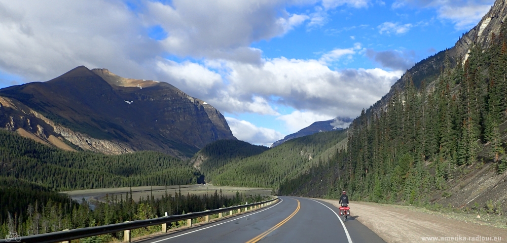 Cycling from Columbia Icefield via Saskatchewan River Crossing to Lake Louise.  Icefields Parkway by bicycle.