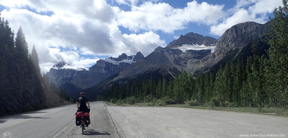 Cycling from Columbia Icefield via Saskatchewan River Crossing to Lake Louise.  Icefields Parkway by bicycle.