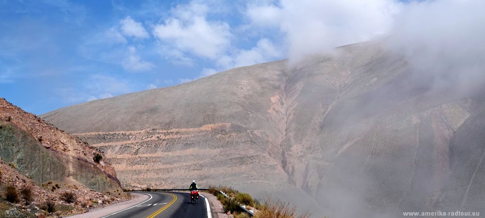 Cycling from Purmamarca to the Salinas Grandes climbing the Cuesta de Lipán.   