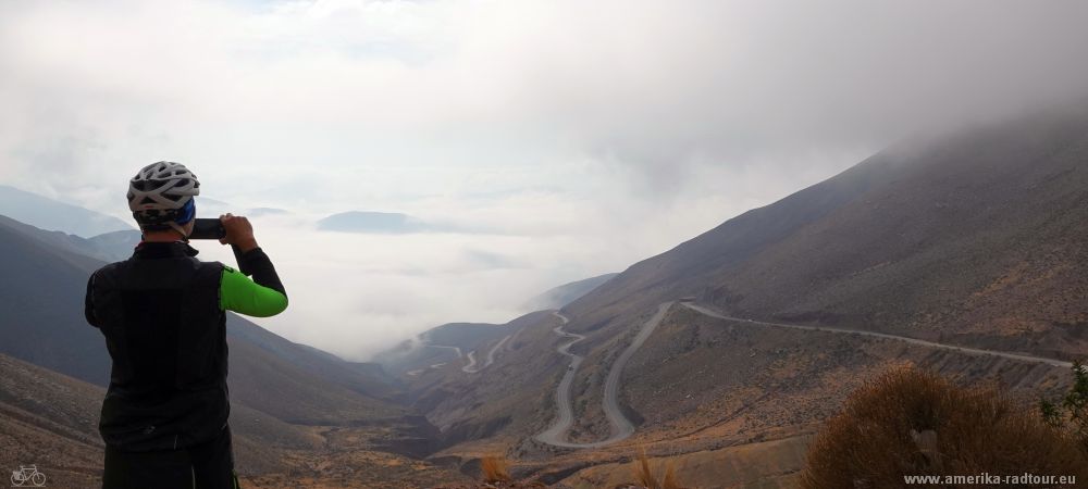 Cycling from Purmamarca to the Salinas Grandes climbing the Cuesta de Lipán.   